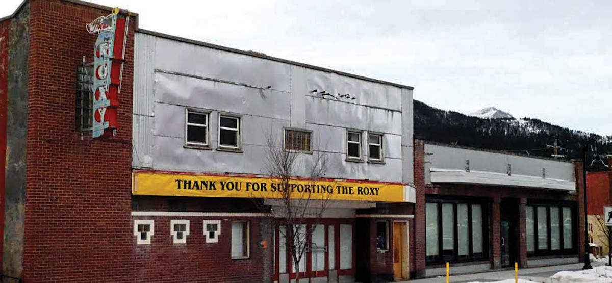 Roxy Theatre – an old brick and tin building with a Roxy marquis sign and a sign reading Thank you for supporting the Roxy